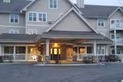 Exterior view of Villa Phoenix entrance with covered porch and warm lighting.