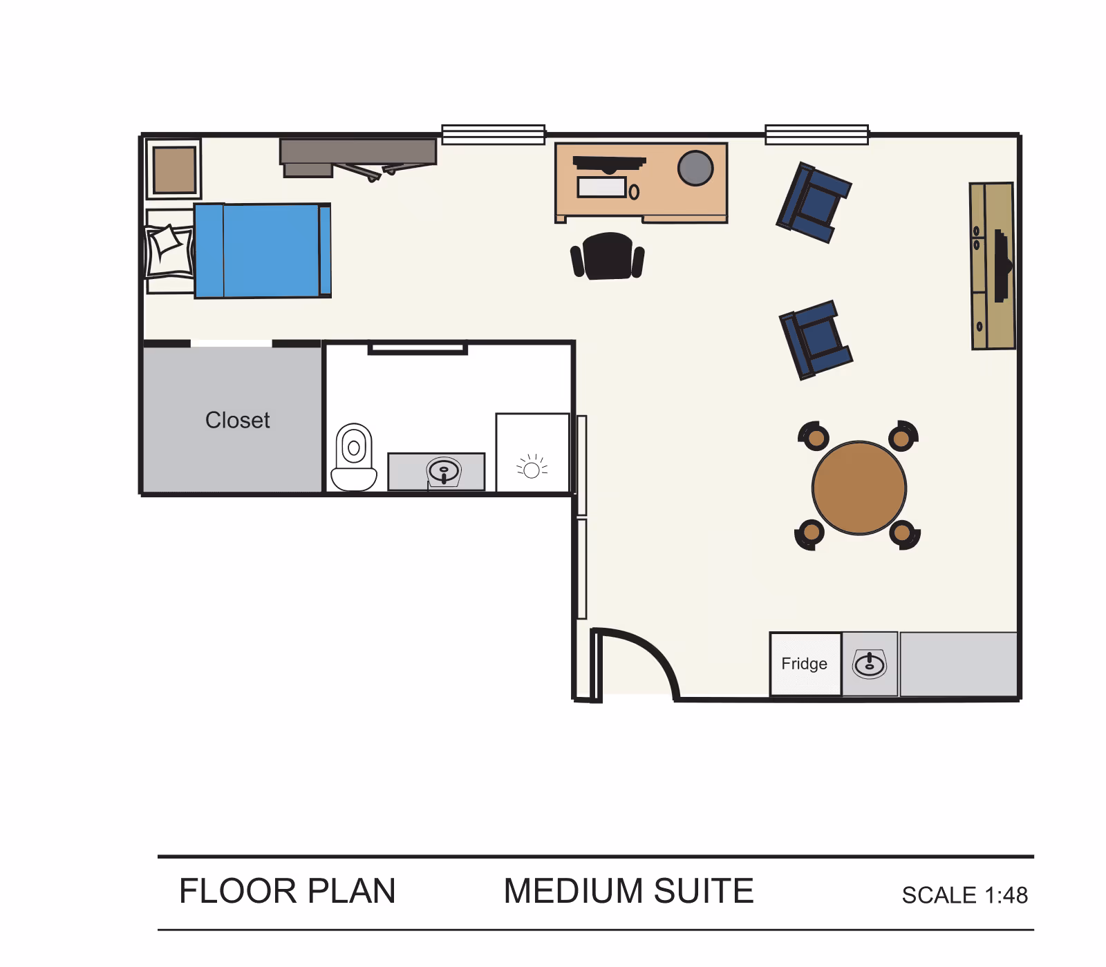 Floor plan of a medium suite showing a bedroom with a bed and closet, a bathroom with toilet and sink, and a living area with a desk, chairs, dining table, TV, and kitchenette with fridge and sink.