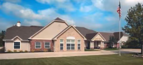Brookdale Bowling Green exterior: single-story building with brick facade and flag on well-kept lawn.