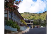 Exterior view of Palolo Chinese Home Lani Booth with hillside backdrop.
