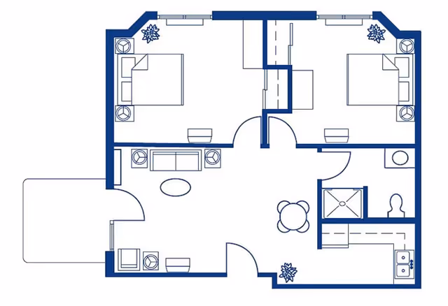Architectural floor plan of a residential unit showing two bedrooms, a living room, a kitchen, a bathroom, and a dining area. The layout includes furniture such as beds, sofas, tables, chairs, and kitchen appliances.