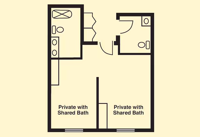 Floor plan showing two private rooms each with a shared bathroom. One bathroom has a bathtub, toilet, and double sink, while the other has a toilet and sink. Both rooms have doors leading to the bathrooms and windows on the opposite walls.