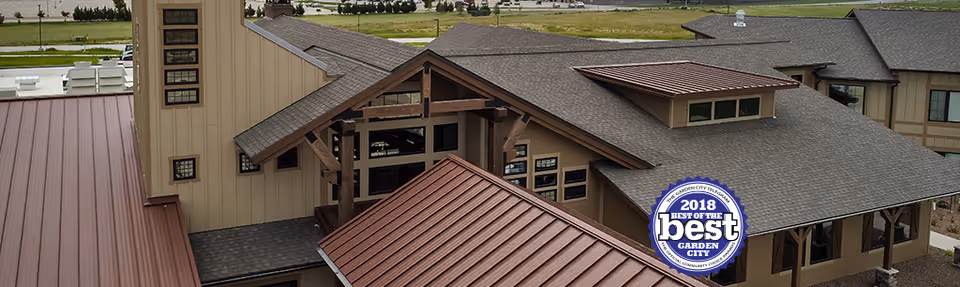 Exterior view of The Ranch House showing multiple rooflines, windows, and an entryway with a circular 'Best of the Best 2018 Garden City' badge.
