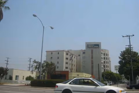 Exterior view of Southern California Hospital at Culver City with a car on the street.