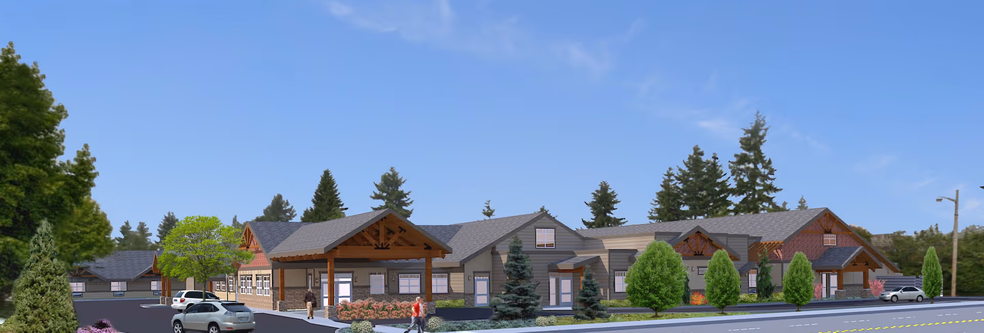 Exterior view of a single-story senior living facility building with a pitched roof, surrounded by trees and shrubs, with a clear blue sky above. Several cars are parked in front, and a few people are walking near the entrance.