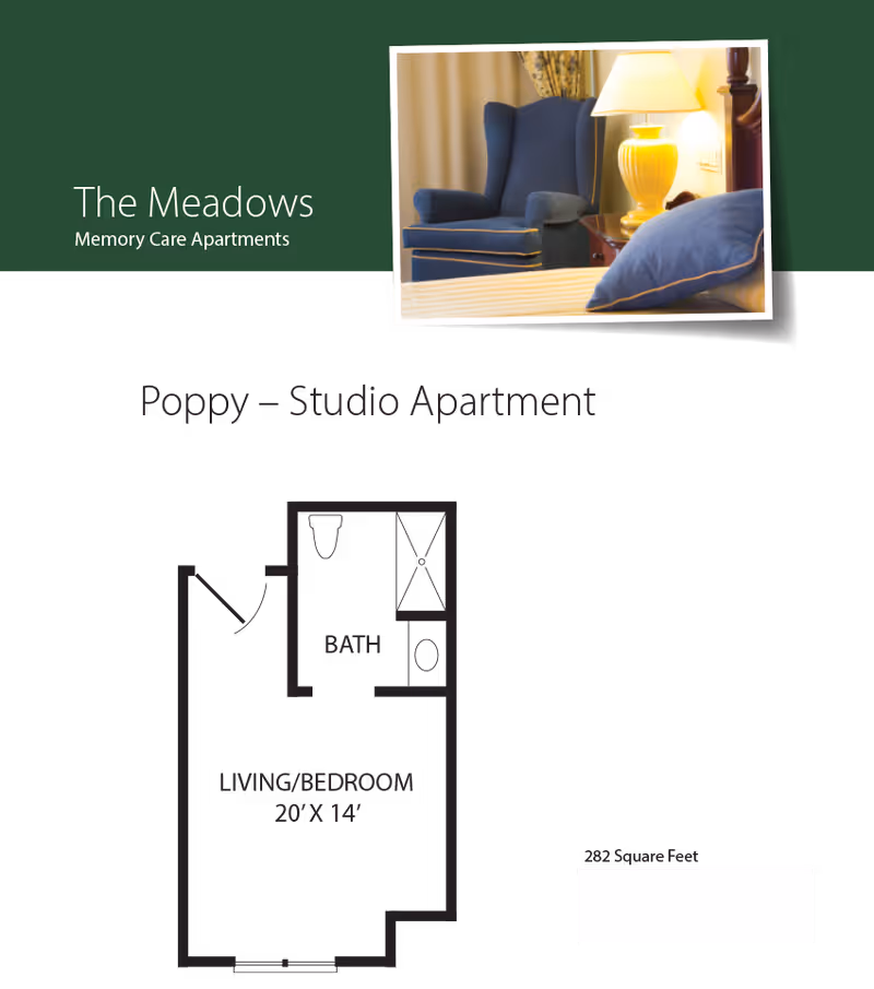 Floor plan of a studio apartment named Poppy at The Meadows Memory Care Apartments, showing a combined living and bedroom area measuring 20 feet by 14 feet, and a bathroom with a shower, toilet, and sink. There is also an inset photo of a blue armchair next to a nightstand with a yellow lamp.