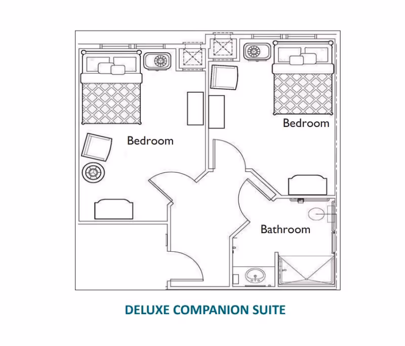 Architectural floor plan of a deluxe companion suite at Morningside House of Spotsylvania showing two bedrooms, a shared bathroom, and a central entry area.