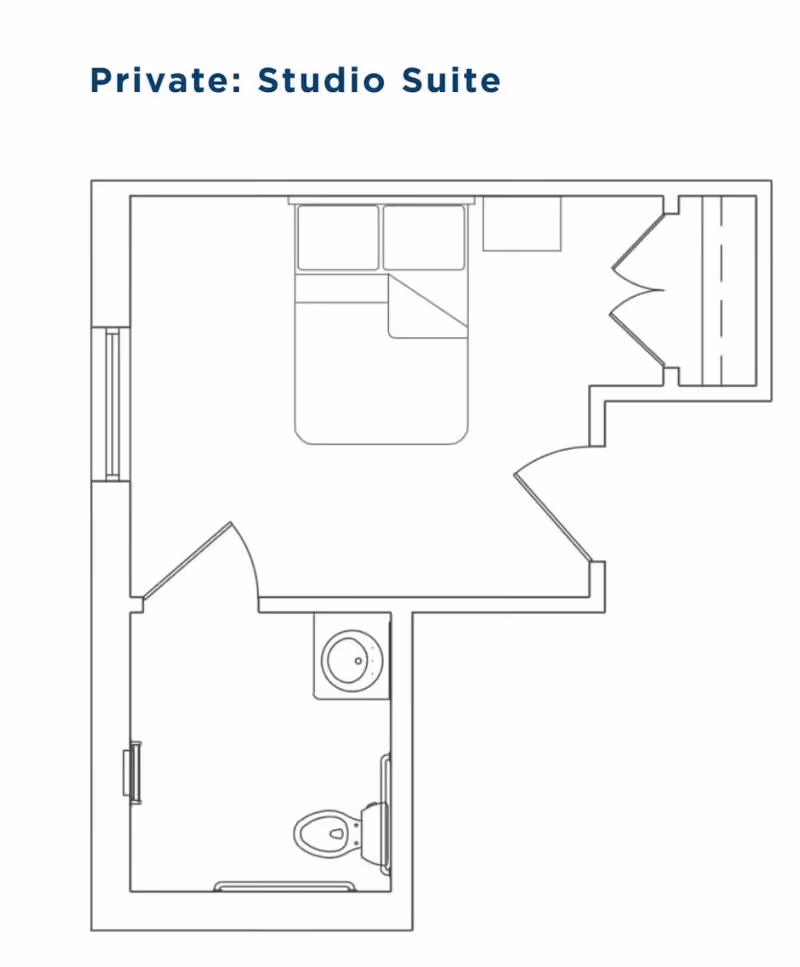 Floor plan layout of a private studio suite showing a bedroom area with a bed and closet, and a separate bathroom with a toilet and sink.