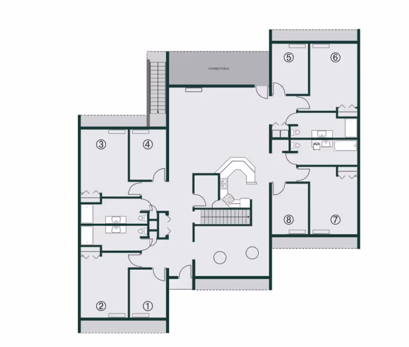 Architectural floor plan of a facility named The Ridge at Madison showing multiple rooms numbered 1 to 8, a covered porch, bathrooms, and a central kitchen area with stairs.