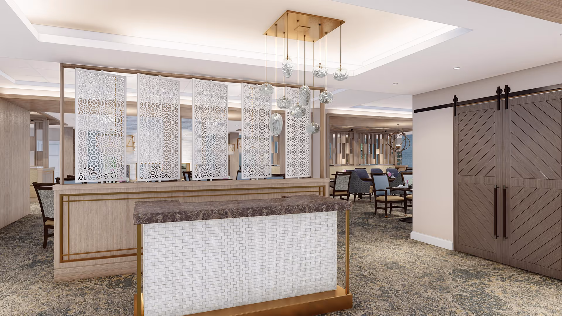 Interior view of a senior living facility dining area with a decorative partition featuring intricate white lattice panels. In the foreground, there is a small counter with a marble top and white tiled front with gold accents. Hanging from the ceiling above the counter are modern pendant lights with glass globes. The dining area in the background has multiple tables and chairs arranged for seating, with a warm and inviting ambiance.