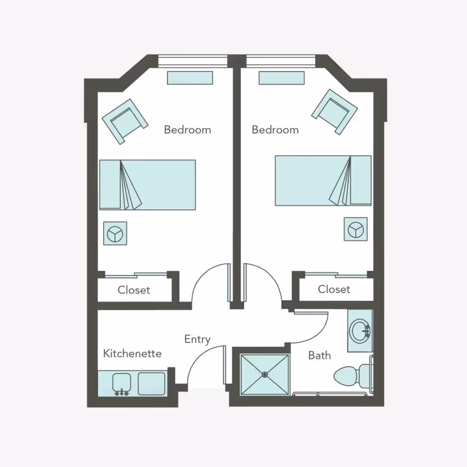 Floor plan of a living space at Aegis Living Shadowridge showing two bedrooms each with a bed, chair, and closet. The layout includes an entry area, a kitchenette with a sink and counter, and a bathroom with a shower, toilet, and sink.