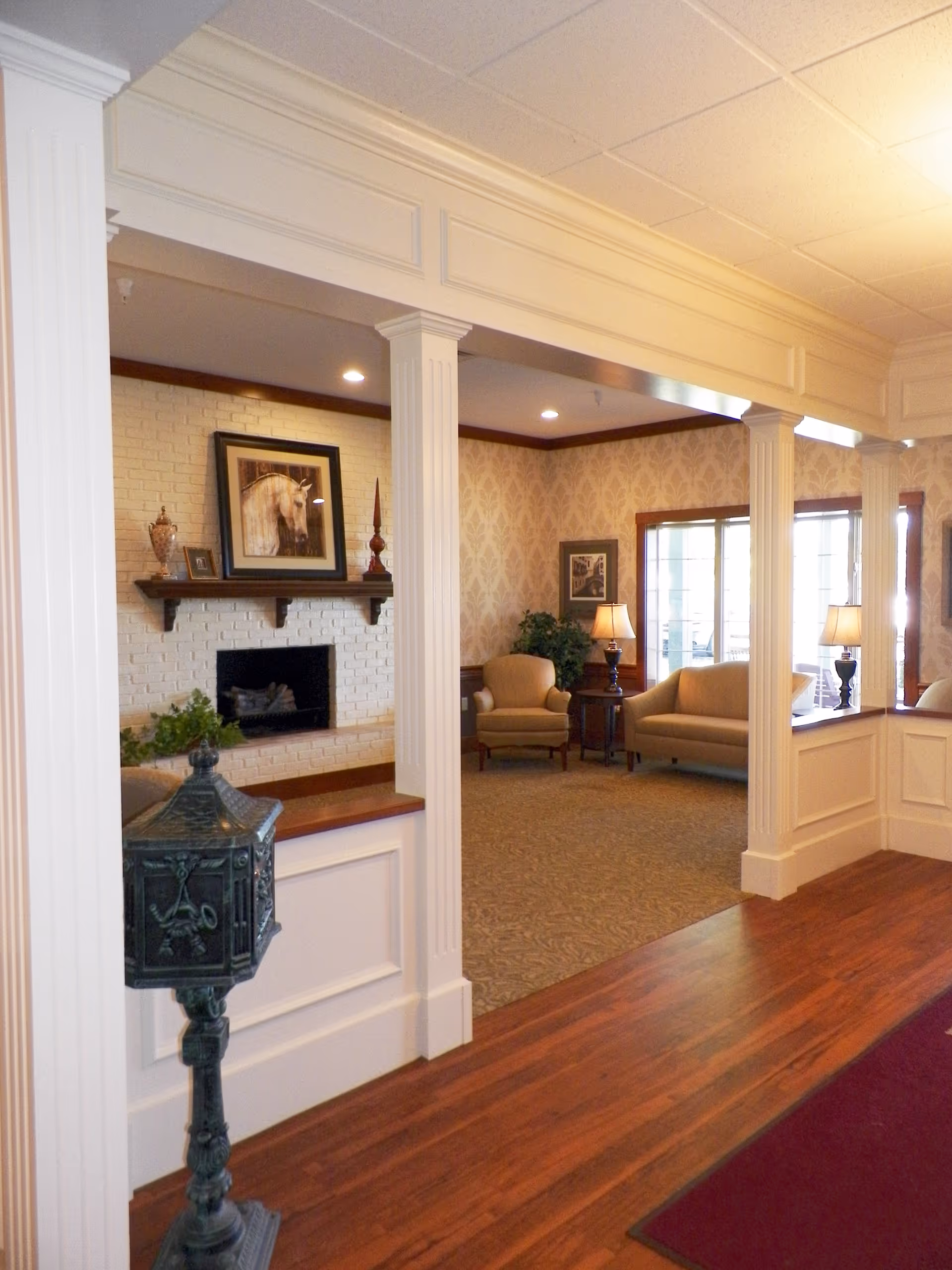 A welcoming lobby of Van Wert Manor featuring comfortable seating and decorative elements.
