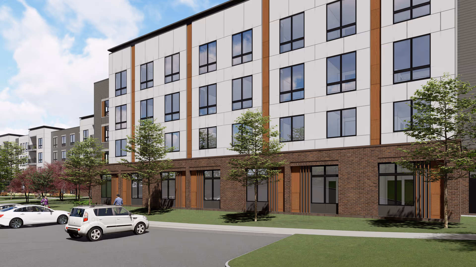 A modern multi-story senior living building with brick base and large windows along the street.