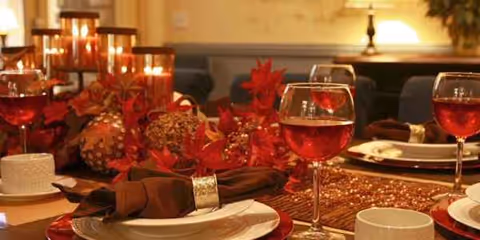 A festive dining table in Pine View Transitional Rehab with candles, glassware, and holiday decor.