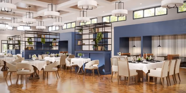 Bright dining room at Rose Senior Living Farmington Hills with cream chairs and modern lighting.