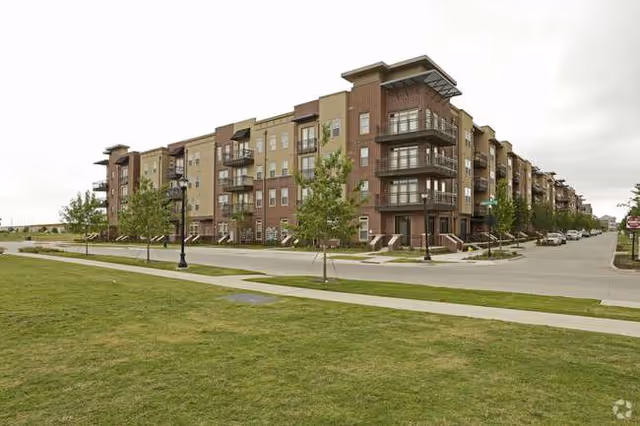 Watermere at Frisco exterior view showing a multi-story senior living building and green lawn.