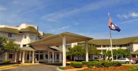 Exterior view of The Fairmont by Barclay House with porte-cochere entrance.