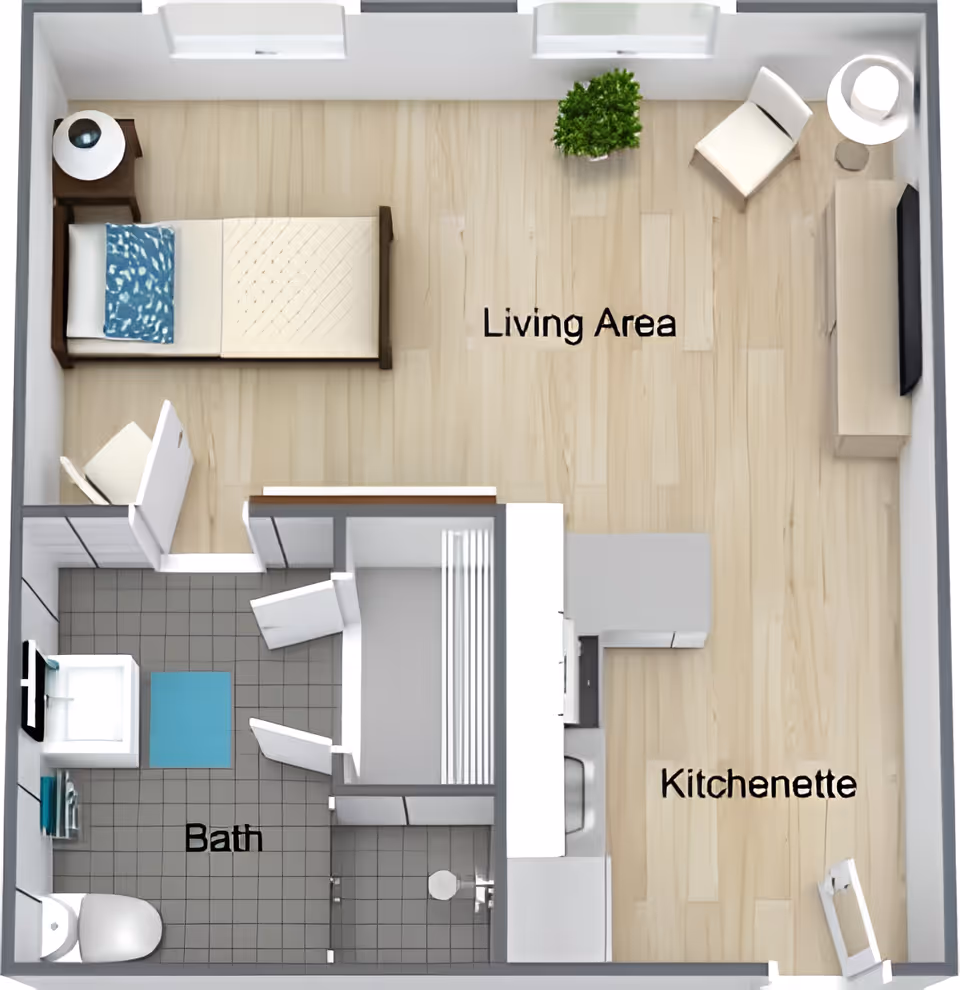 Top-down floor plan of a studio apartment showing a living area, kitchenette, and bathroom.
