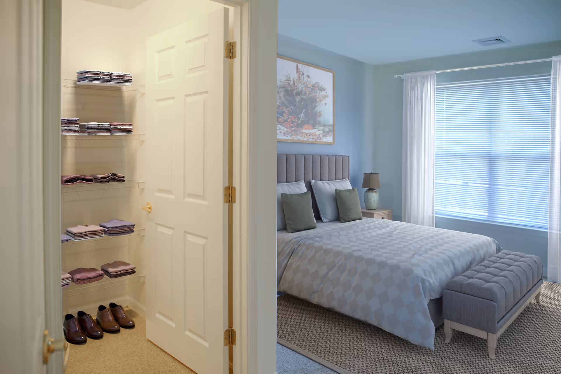 Bedroom with a neatly made bed, bench, nightstand, and open closet with towels.