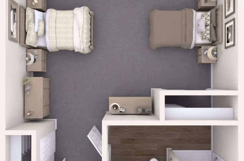 Top-down view of a bedroom layout with two single beds, each with pillows and blankets. The room includes two nightstands with lamps, a dresser, framed pictures on the walls, and a small hallway leading to a bathroom with a shower.