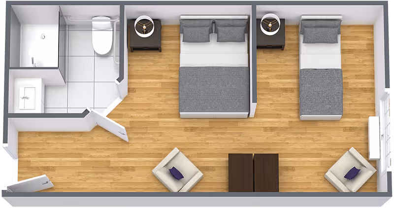 Top-down view of a floor plan showing a room with two beds, two nightstands with lamps, two armchairs, a small table between the chairs, and an attached bathroom with a shower, toilet, and sink.