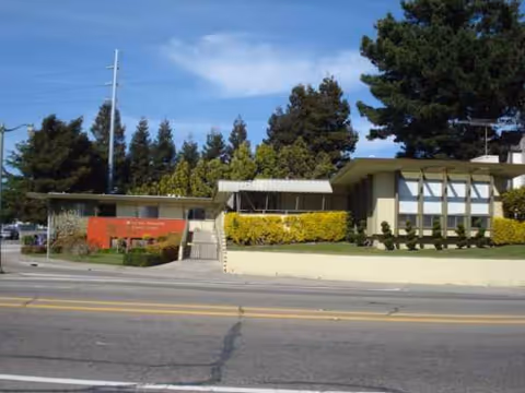 Exterior view of Marina Garden Nursing Center storefront and entrance with landscaping.