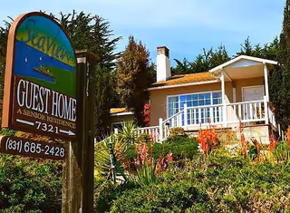 Exterior view of Seaview Guest Home with sign and landscaped front yard.