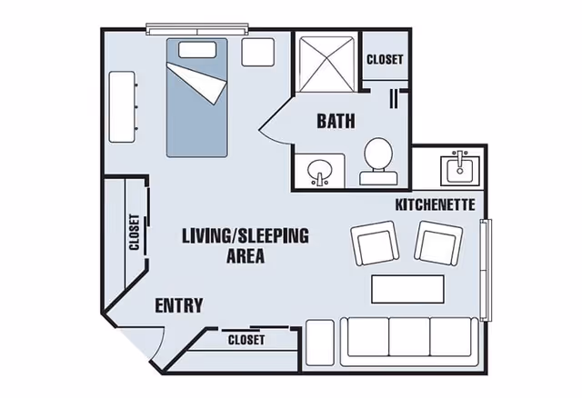 Floor plan of a senior living community unit showing an entry area, living/sleeping area with a bed and sofa, kitchenette with two chairs and a table, a bathroom with a shower, toilet, and sink, and multiple closets.