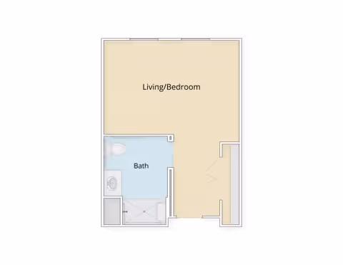 Color-coded studio floor plan showing a combined living/bedroom area and a separate bath with toilet, sink, and shower.