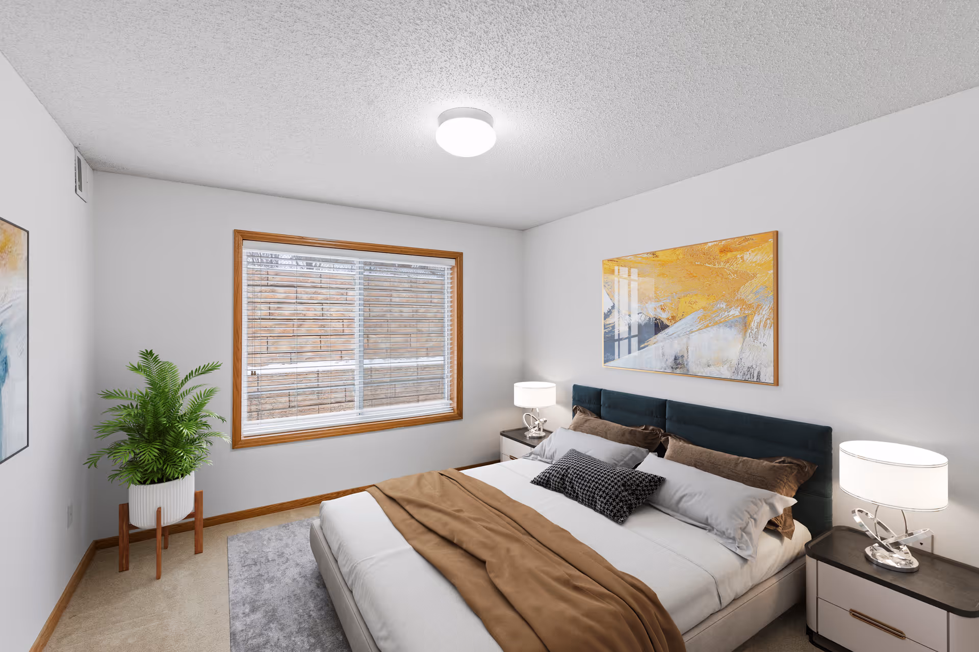 A neatly arranged bedroom with a large bed featuring white and brown bedding, two bedside tables with lamps, a large window with blinds, a green potted plant on a wooden stand, and abstract artwork on the walls.