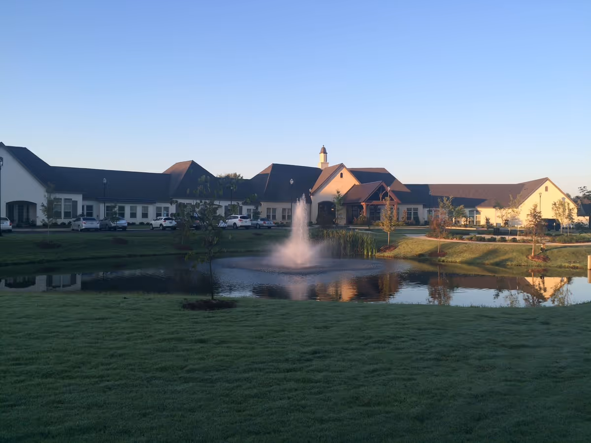 Exterior view of The Goldton at Adelaide with a pond and fountain in foreground