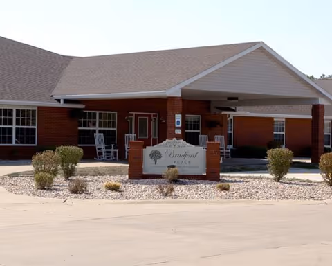Front view of Bradford Place senior living facility with brick exterior and welcoming entrance.
