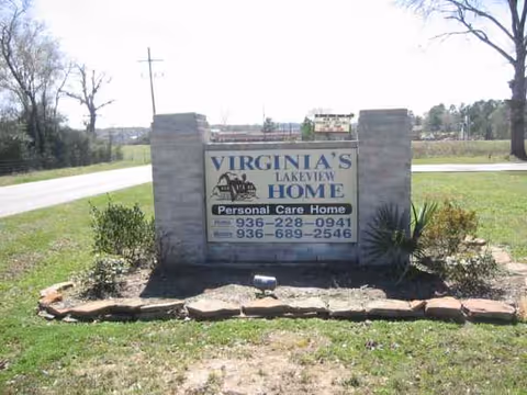 Stone sign reads Virginia's Lakeview Home Personal Care Home beside a grassy road