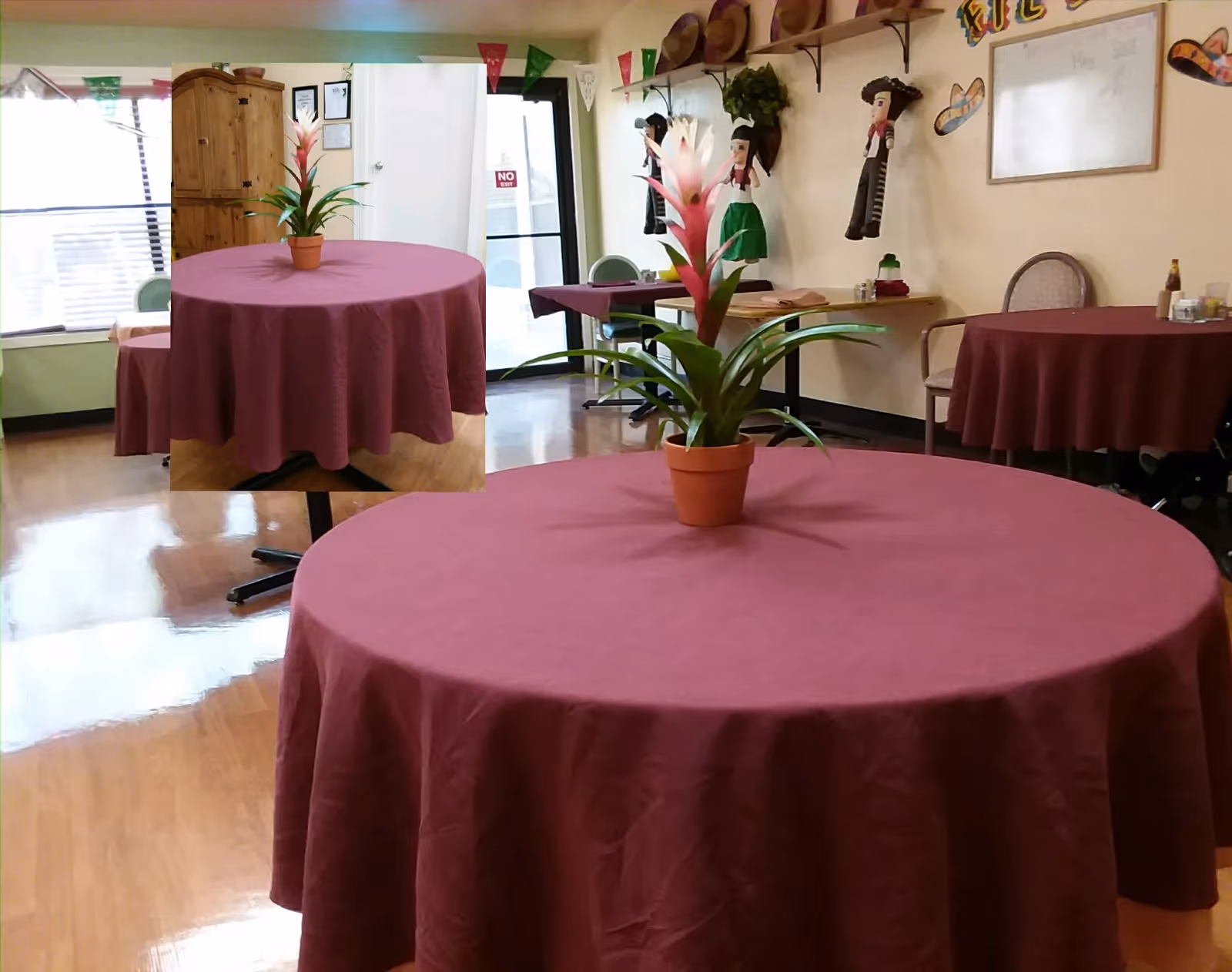 Communal dining/activity room with round tables covered in maroon tablecloths and potted plants as centerpieces, chairs and wall decorations in the background.