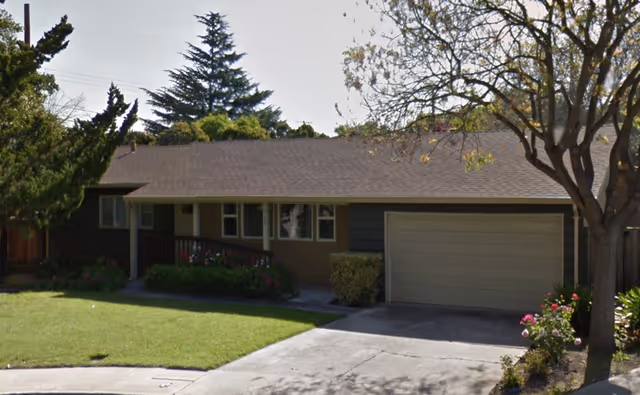 Unicorn Residential Care Home front exterior: a single-story house with a two-car garage and lawn.