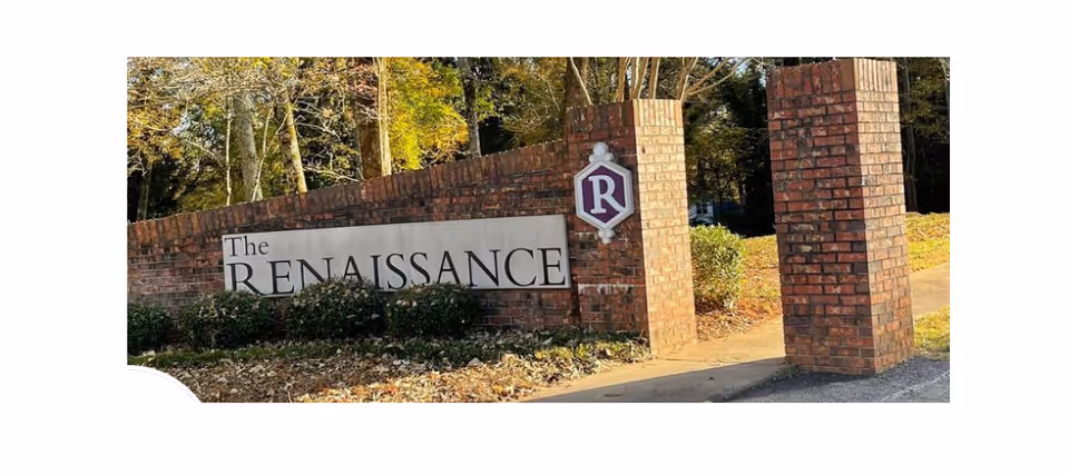 Brick entrance sign for The Renaissance Senior Living with tall brick pillars