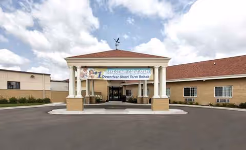 Front view of Belle Fountain Nursing & Rehab entrance with porte-cochere.
