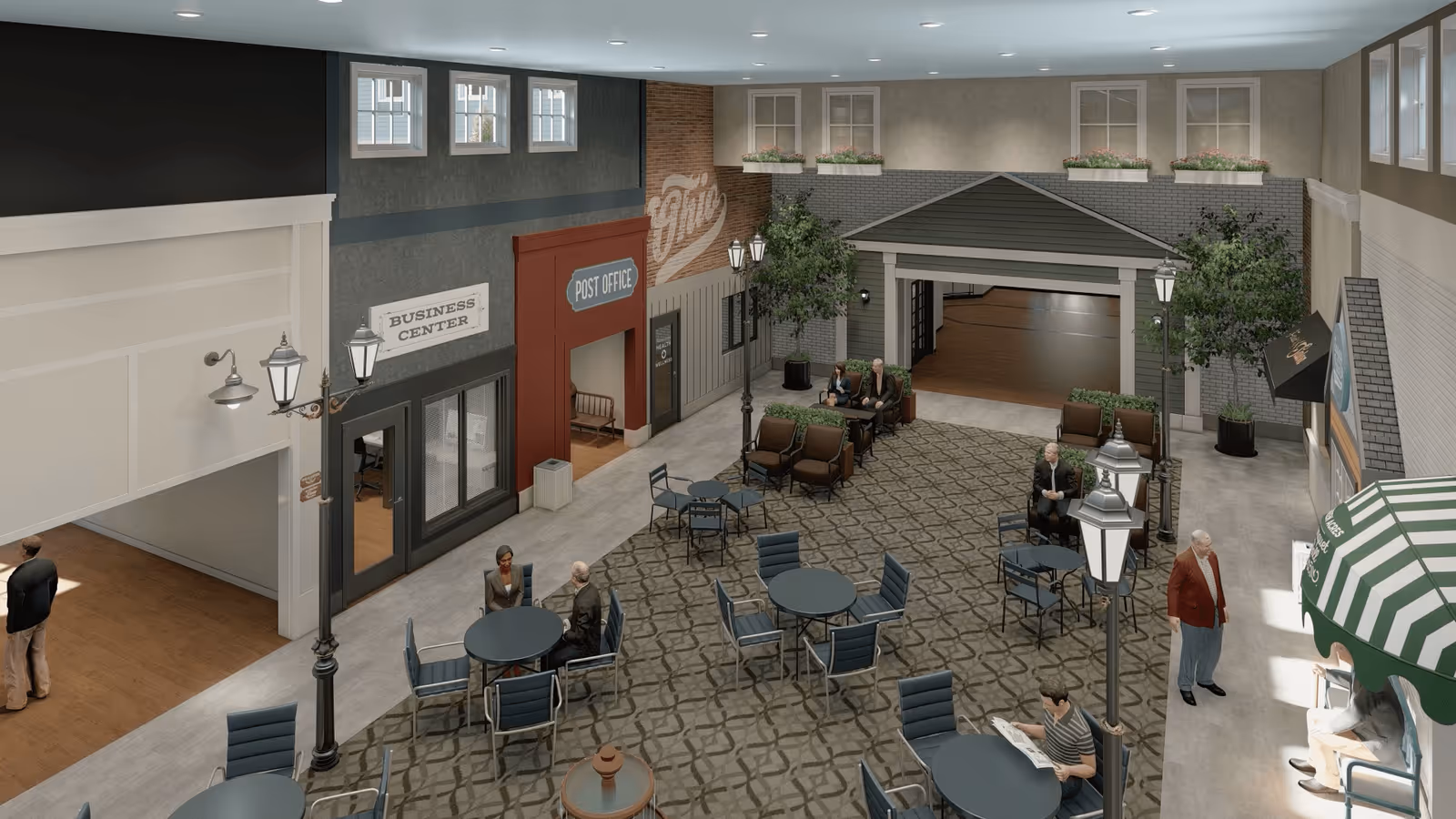 Indoor common area designed like a small town square with tables and chairs, street lamps, and storefronts labeled Business Center and Post Office. Several people are seated or standing around the area, which has a patterned carpet and potted plants.