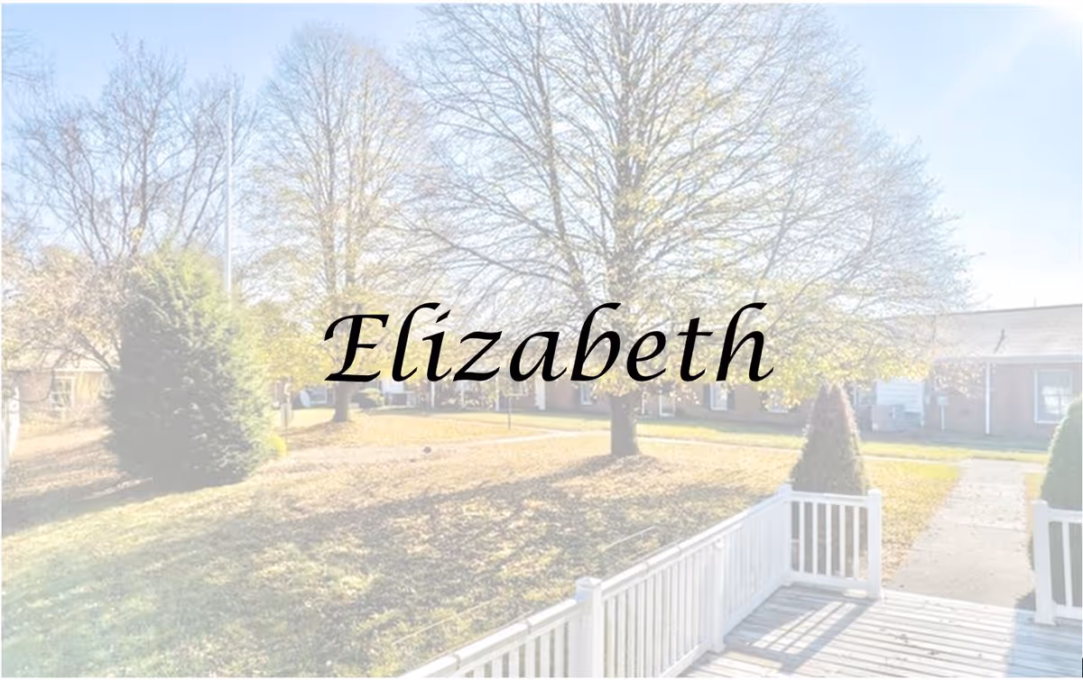 Front porch and courtyard of a senior living facility with trees and a low brick building in the background, overlaid with the word 'Elizabeth'.