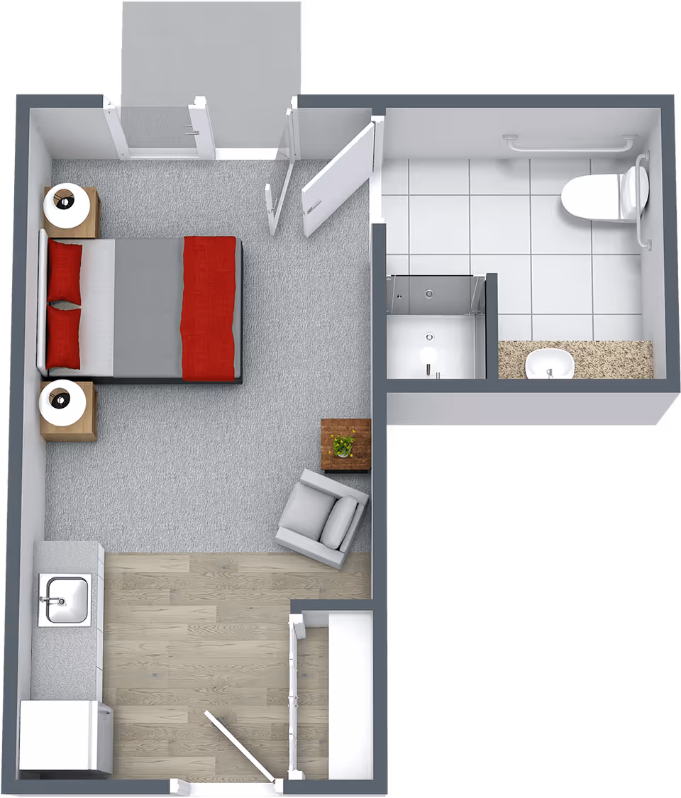 Top-down floor plan of a studio apartment showing a bed with nightstands, a small seating area, kitchenette, and a separate bathroom with shower and toilet.