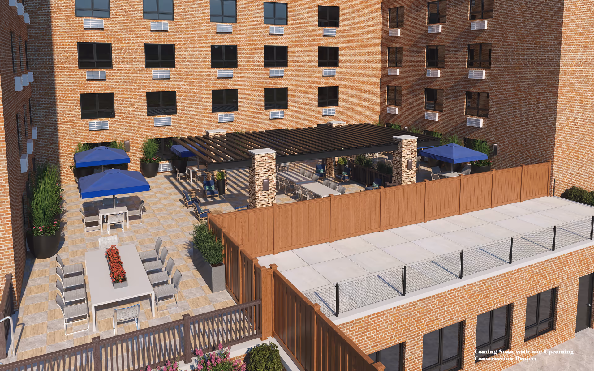 Outdoor patio area at The Veranda Assisted Living featuring multiple seating arrangements including tables with chairs and blue umbrellas, a pergola with additional seating underneath, potted plants, and surrounded by brick building walls with multiple windows.
