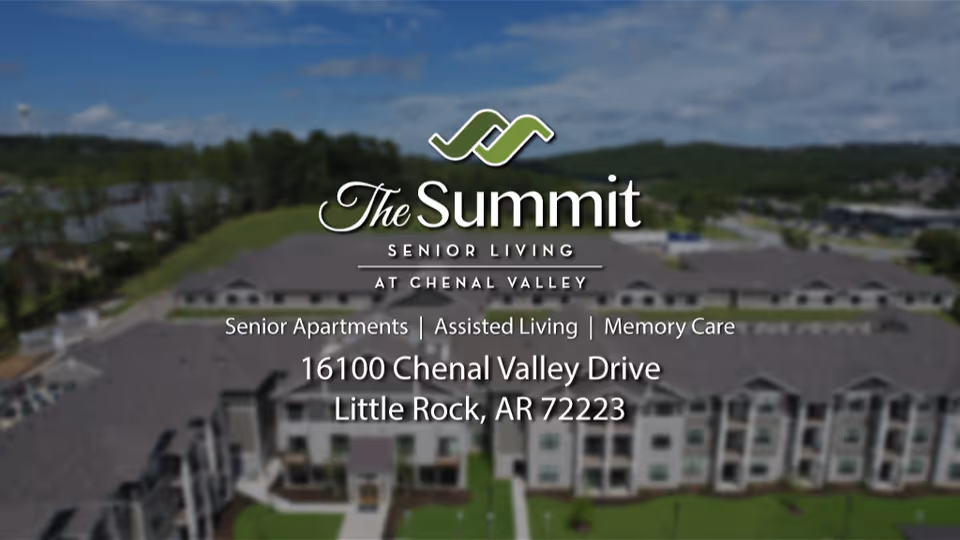 Aerial view of The Summit senior living building with the facility logo and address overlaid.