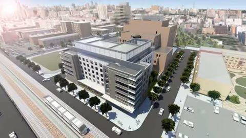 A modern multi-story skilled nursing facility exterior rendered from an aerial perspective.