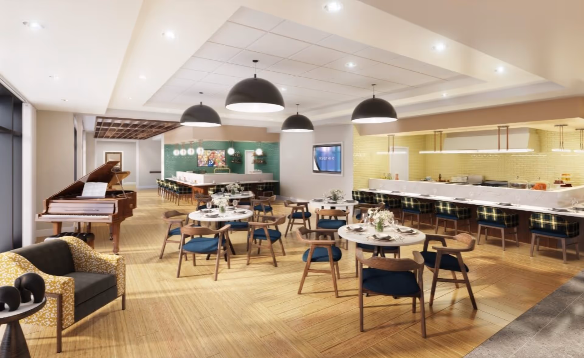 A spacious and modern dining area with round tables set with plates, glasses, and floral centerpieces. Wooden chairs with blue cushions surround the tables. To the right, there is a long counter with plaid cushioned bar stools and a kitchen area with yellow tiled walls and hanging lights. On the left side, there is a grand piano with sheet music, a yellow patterned armchair, and a small side table with decorative objects. The ceiling has recessed lighting and large black pendant lights hanging above the dining tables. A TV screen on the wall displays the word 'WEATHER'.