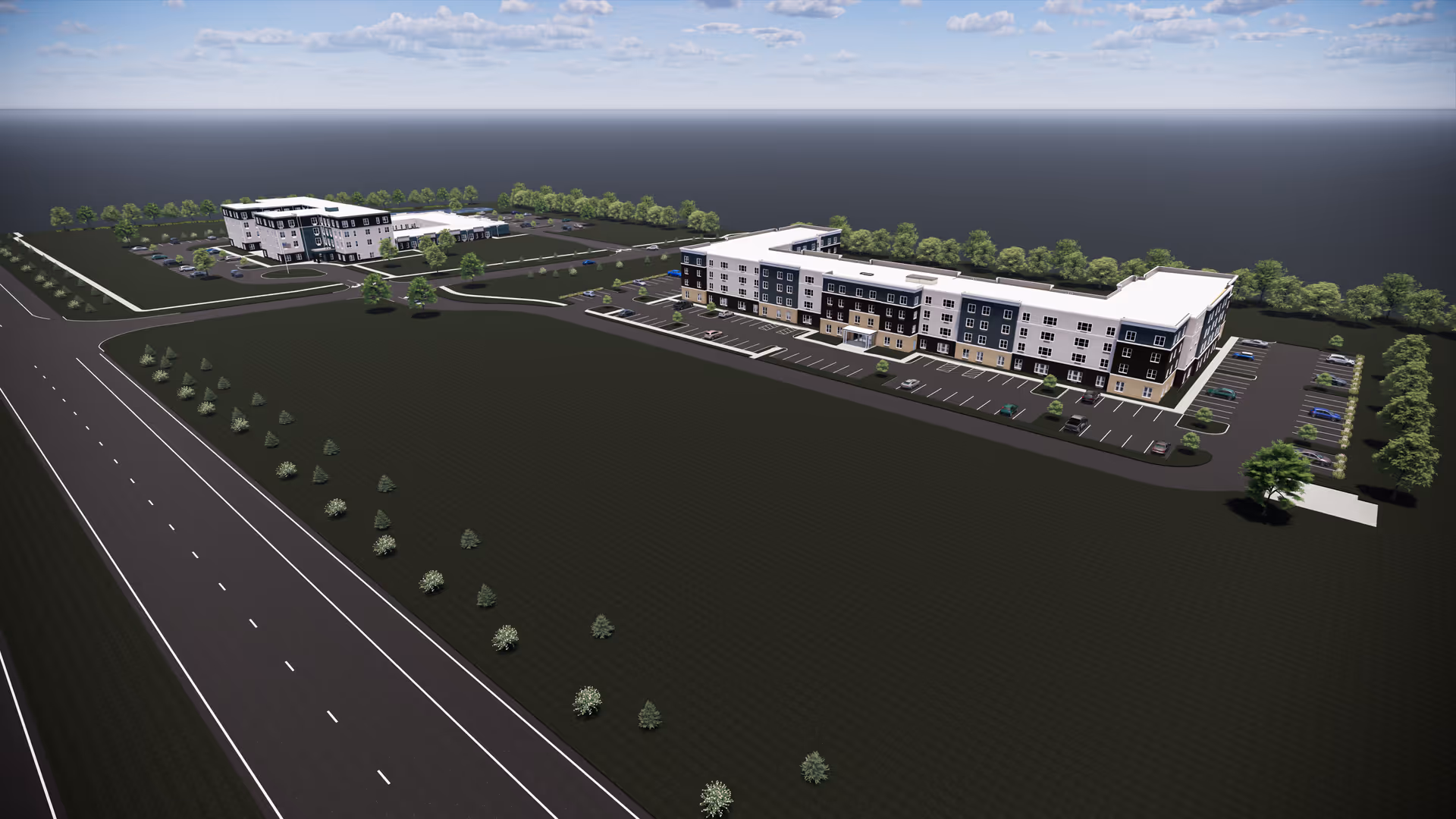 Aerial rendering of two multi-story senior living buildings with parking lots, driveways, and landscaped grounds beside a multi-lane road.