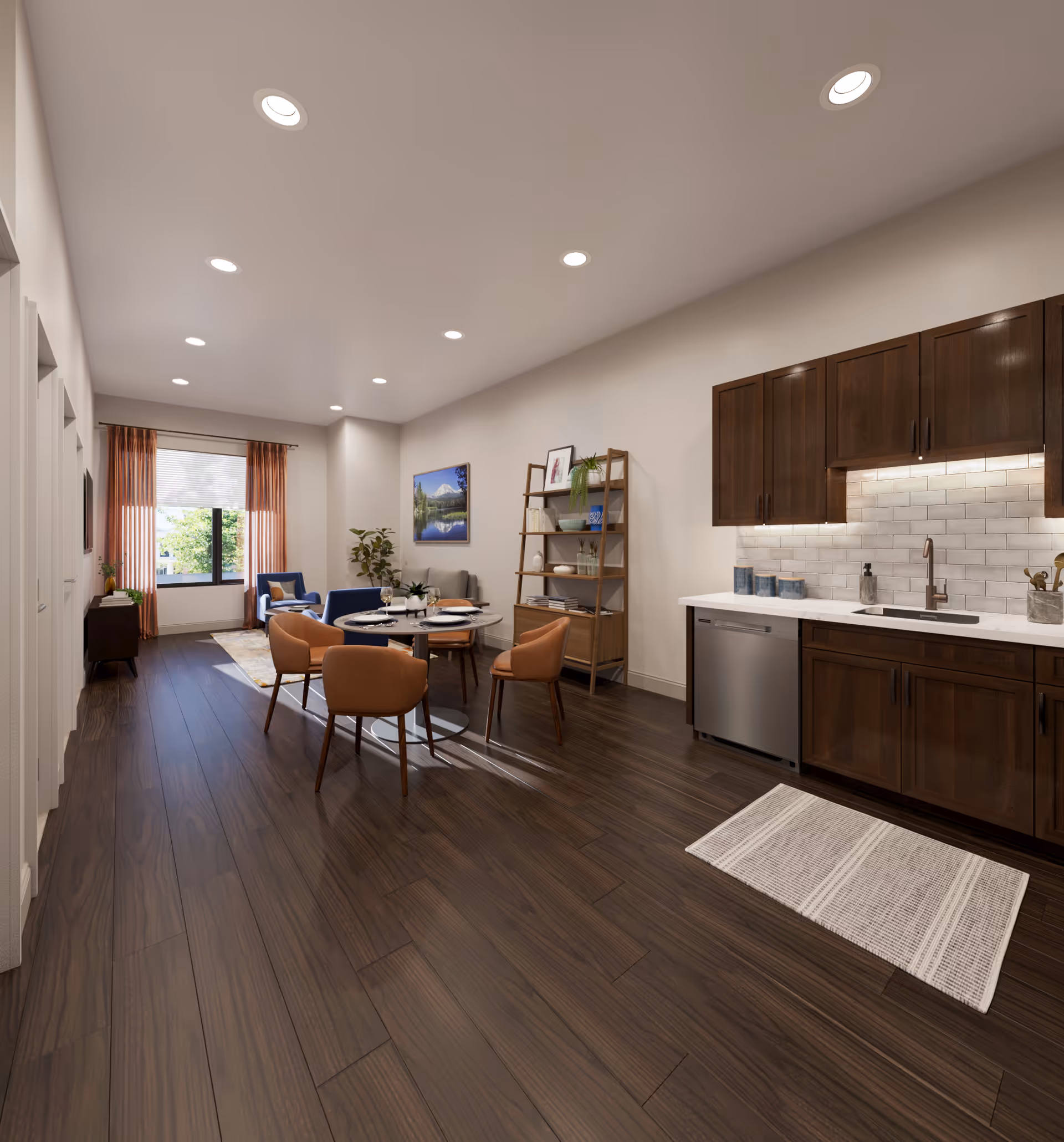 A modern open-concept living space featuring a kitchen with dark wood cabinets, white countertops, and a tiled backsplash. The kitchen area includes a dishwasher and a sink with a faucet. Adjacent to the kitchen is a dining area with a round table set for four and four brown upholstered chairs. Beyond the dining area is a living room with a blue sofa, a small side table, a plant, and a large window with orange curtains letting in natural light. The floor is dark wood, and the ceiling has recessed lighting.
