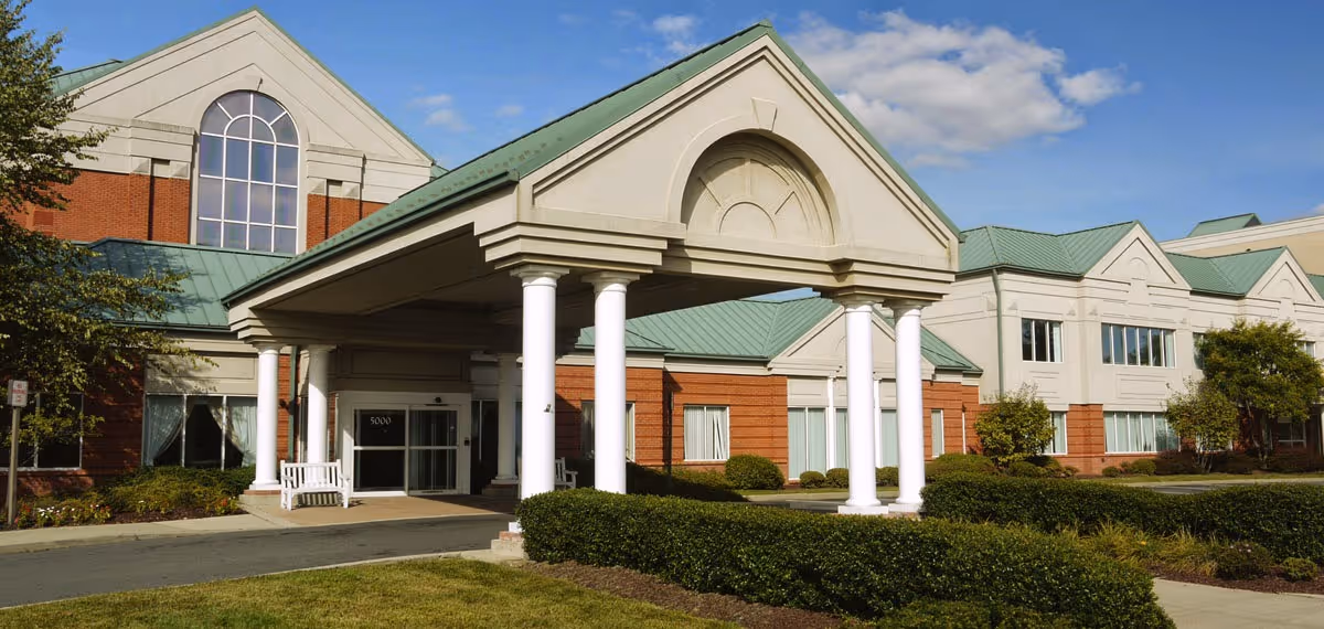 Exterior view of Carnegie Post Acute Care at Princeton showing the building front with a covered entrance and white columns.