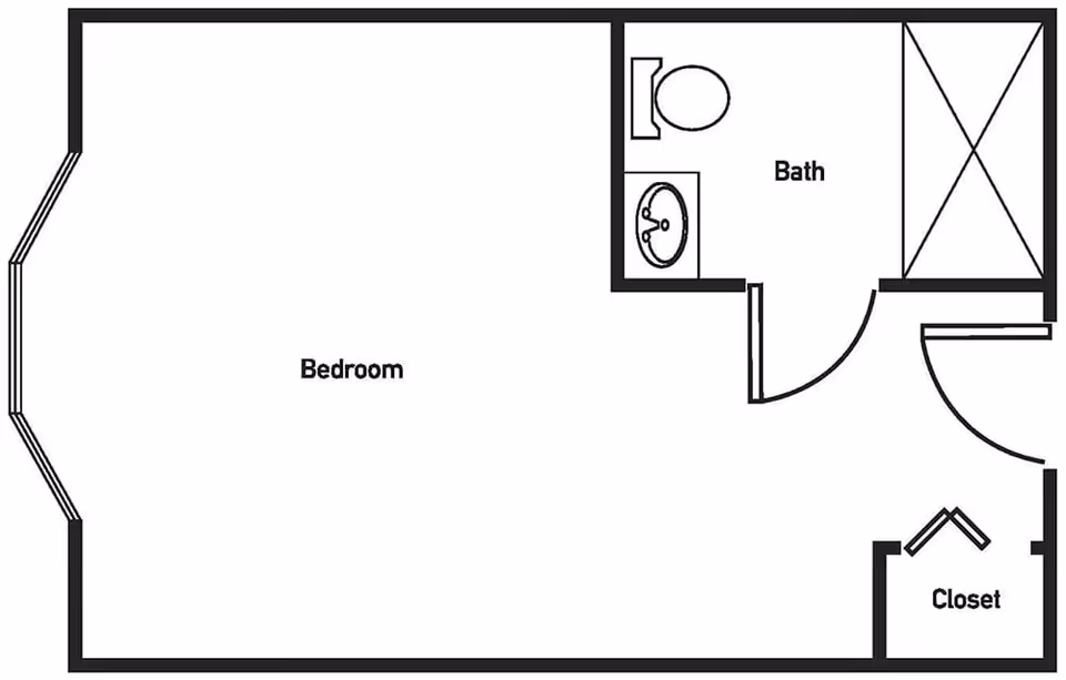 Floor plan layout showing a bedroom with a bay window, an attached bathroom with a toilet, sink, and shower, and a closet near the entrance.