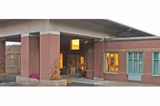 Brick exterior of Mountain Top Rehabilitation and Healthcare Center with a covered entrance.