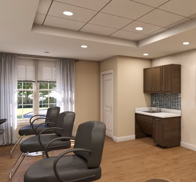 A bright salon room with three black styling chairs, a window with curtains, and a sink with wooden cabinets.